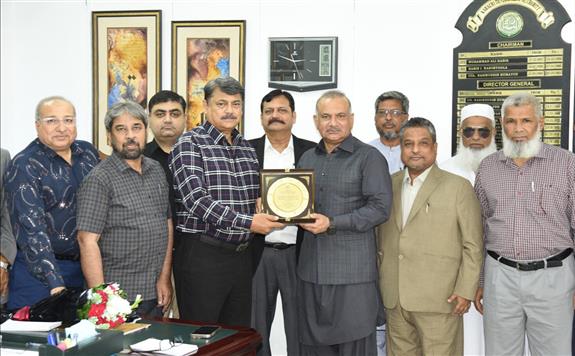Director General Karachi Development Authority Asif Jan Siddiqui presented a shield of honor to Kamal Ahmed Siddiqui for 37 years of service.